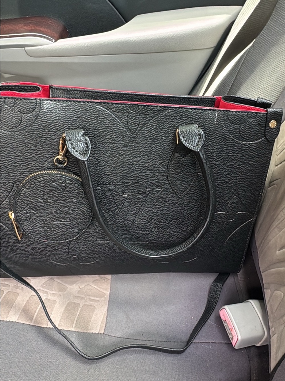 Black Leather Tote with Red Interior and Embossed Pattern